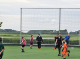 Laatste training S.K.N.W.K. JO11-1JM (partijtje tegen de ouders) van maandag 27 mei 2024 (108/137)